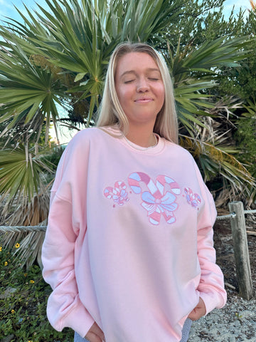 Cozy Light Pink Sweatshirt with Candy Cane Wonderland Print