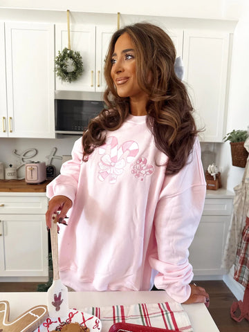 Cozy Light Pink Sweatshirt with Candy Cane Wonderland Print