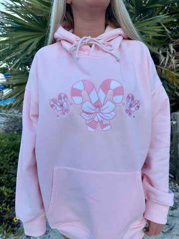 Cozy Pink Candy Cane Hoodie for Festive Street Style