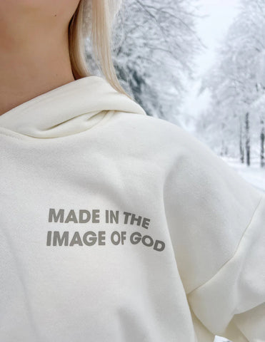 Cozy Cream Hoodie with Inspirational Bible Verse Genesis 1:27
